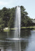 Scott Aerator Gusher Fountain with pine trees in background