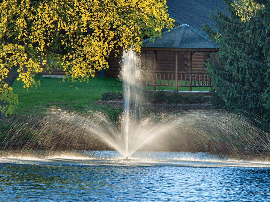 Scott Aerator Great Lakes Fountain closeup with house and trees