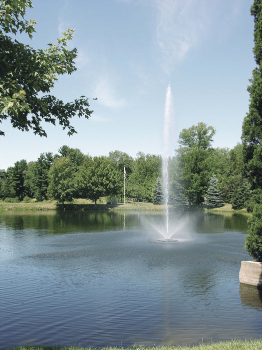 Scott Aerator Skyward Fountain from a distance in wooded background