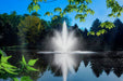 Scott Aerator Triad Fountain in front of pine trees in spring
