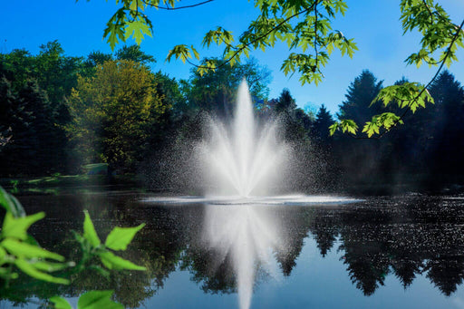 Scott Aerator Triad Fountain in front of pine trees