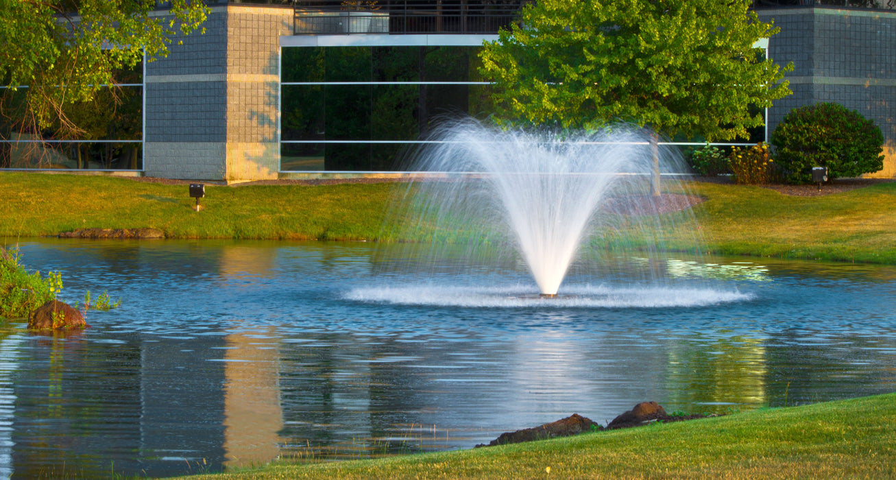 Scott Aerator Display Fountain Aerator DA-20 in front of a small office building