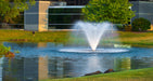 Scott Aerator Display Fountain Aerator DA-20 in front of a small office building
